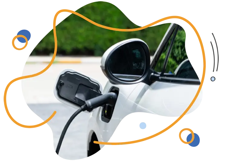 Electric vehicle charging point connected to a white car, showcasing modern charging technology for sustainable energy solutions.